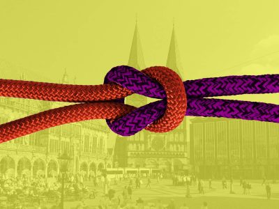 2 Seile unterschiedlicher Farbe zu einem Knoten verknüpft - gelbgrüner Hintergrund.